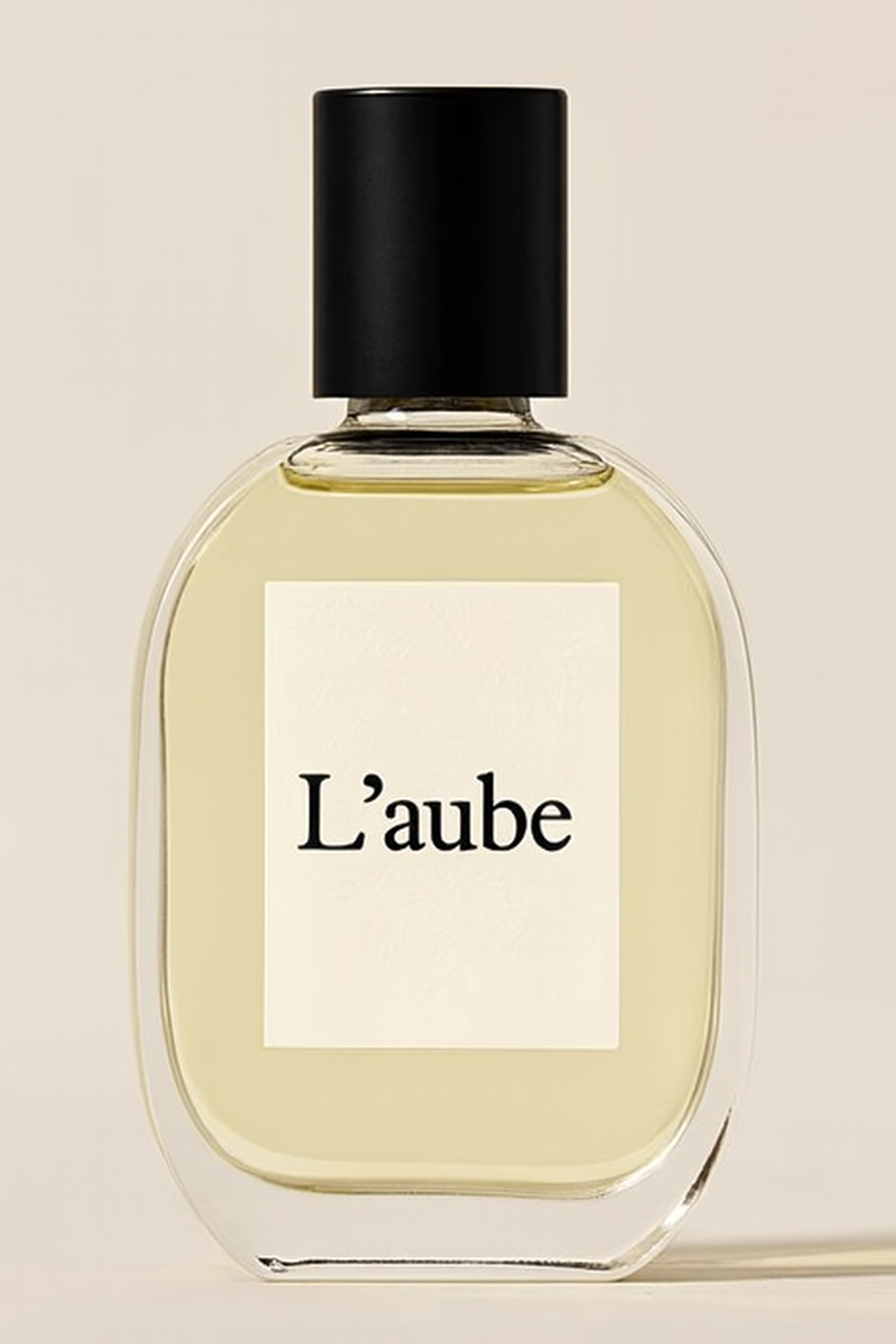 L’aube perfume bottle with black cap
